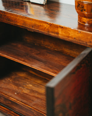 Wooden Sideboard with Reddish Hue
