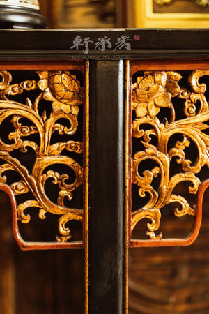 An elegant intricately carved everted flange console table