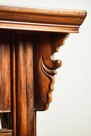An elegant Ming-style mahogany coffee table