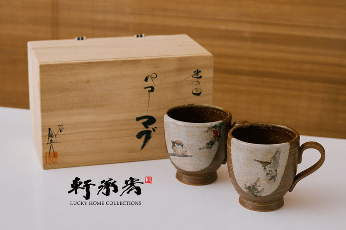 pair of kutaniware porcelain couple mugs hand drawn in sparrow motifs