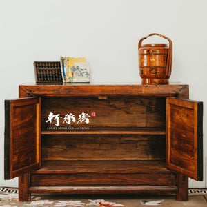sideboard with worn painting of floral motifs