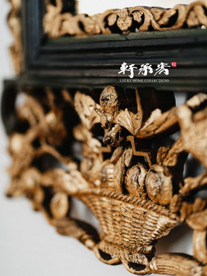 intricately carved framed mirror